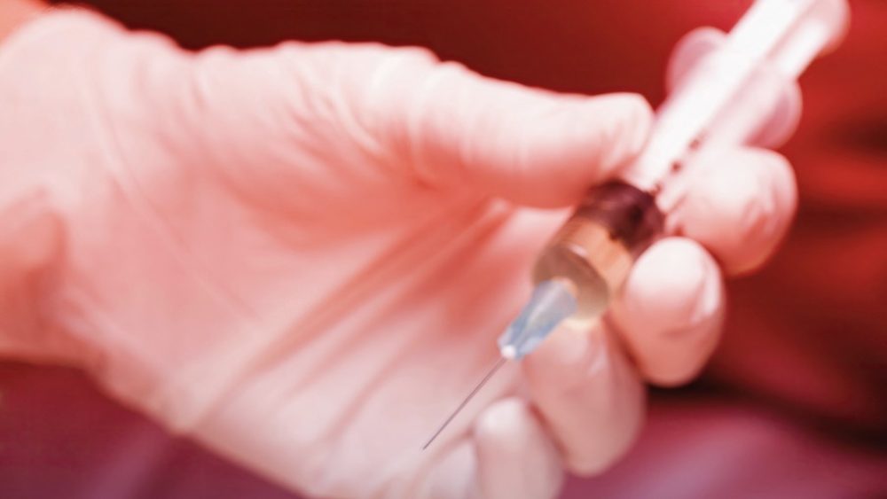 AFP__20250618__f0452508__v1__HighRes__GlovedHandHoldingSyringe