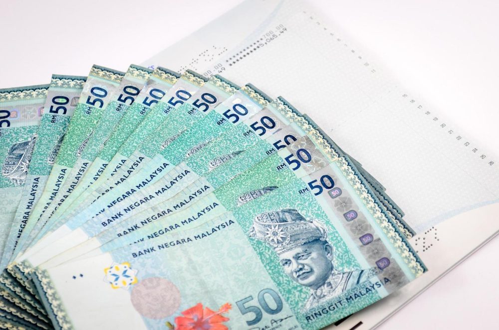 business-and-finance-composition-account-book-with-malaysia-ringgit-free-photo