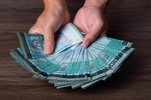 hand-hold-each-banknote-of-50-ringgit-malaysia-finance-concept-photo