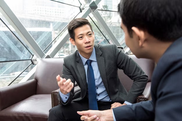 asian-chinese-businessman-talking-with-his-partner_8087-1408