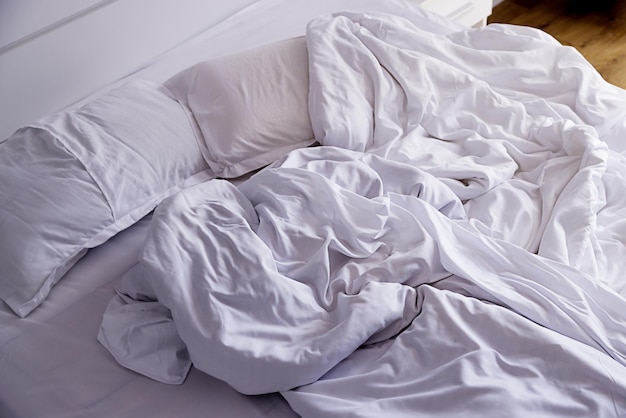 bed-bedroom-closeup-crumpled-linens-unmade-bed-morning-light-cozy-home_584999-784