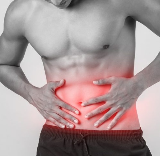 young-handsome-muscular-man-has-abdominal-pain-isolated-white-background-1296x700