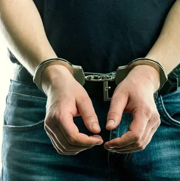 depositphotos_268831848-stock-photo-adult-male-arrested-and-handcuffed.jpg
