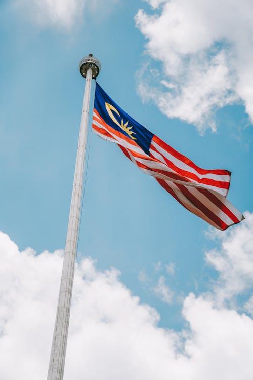 free-photo-of-malaysia-s-flag-flying-high-in-the-sky