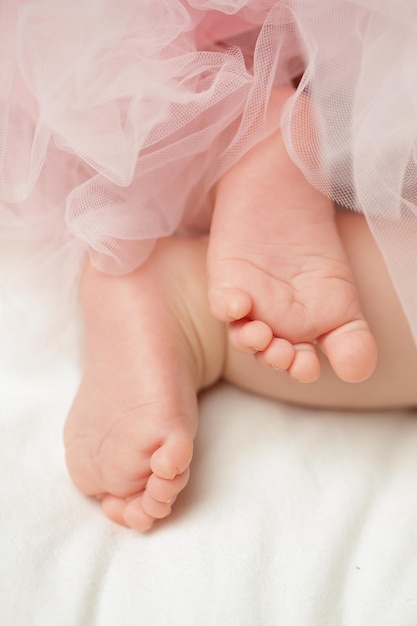 baby-girls-feet-with-tulle-dress