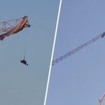 滑翔伞意外勾挂塔吊 男子悬空30米卡吊臂动弹不得