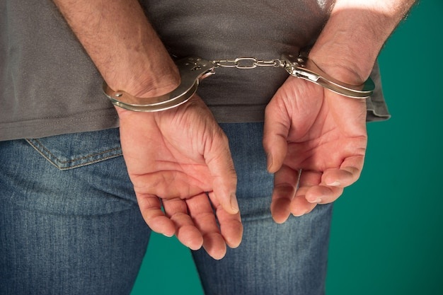arrested-man-handcuffed-hands-ba