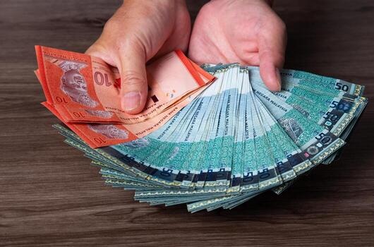 hand-hold-each-banknote-of-50-ri