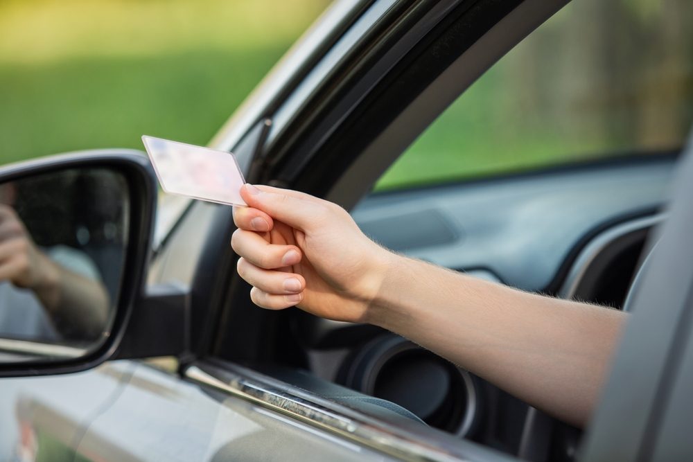 KPT-Legal-Car-driver-handing-his-car-licence-at-a-police-stop