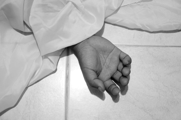 dead-body-laying-floorfocus-hand