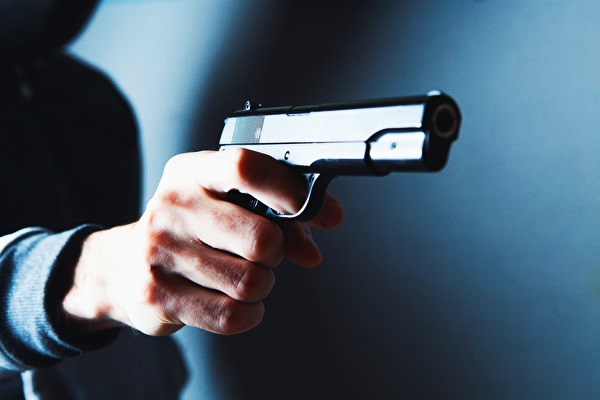 Man,Holds,A,Gun,In,His,Hands,And,Threatens