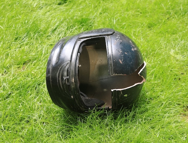 broken-motorcycle-helmet-ground
