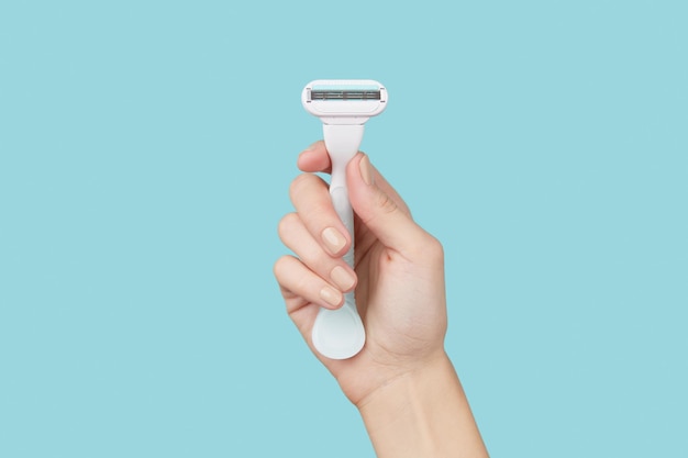 precision-hand-razor-held-against-striking-blue-backdrop-capturing-essence-grooming_113876-18547