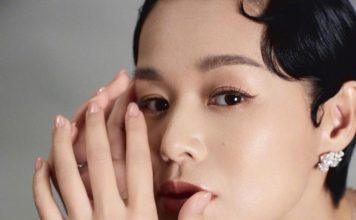胡杏儿上海优雅亮相 黑色露背礼服展现好状态