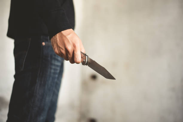 close-up-of-man-holding-knife-in
